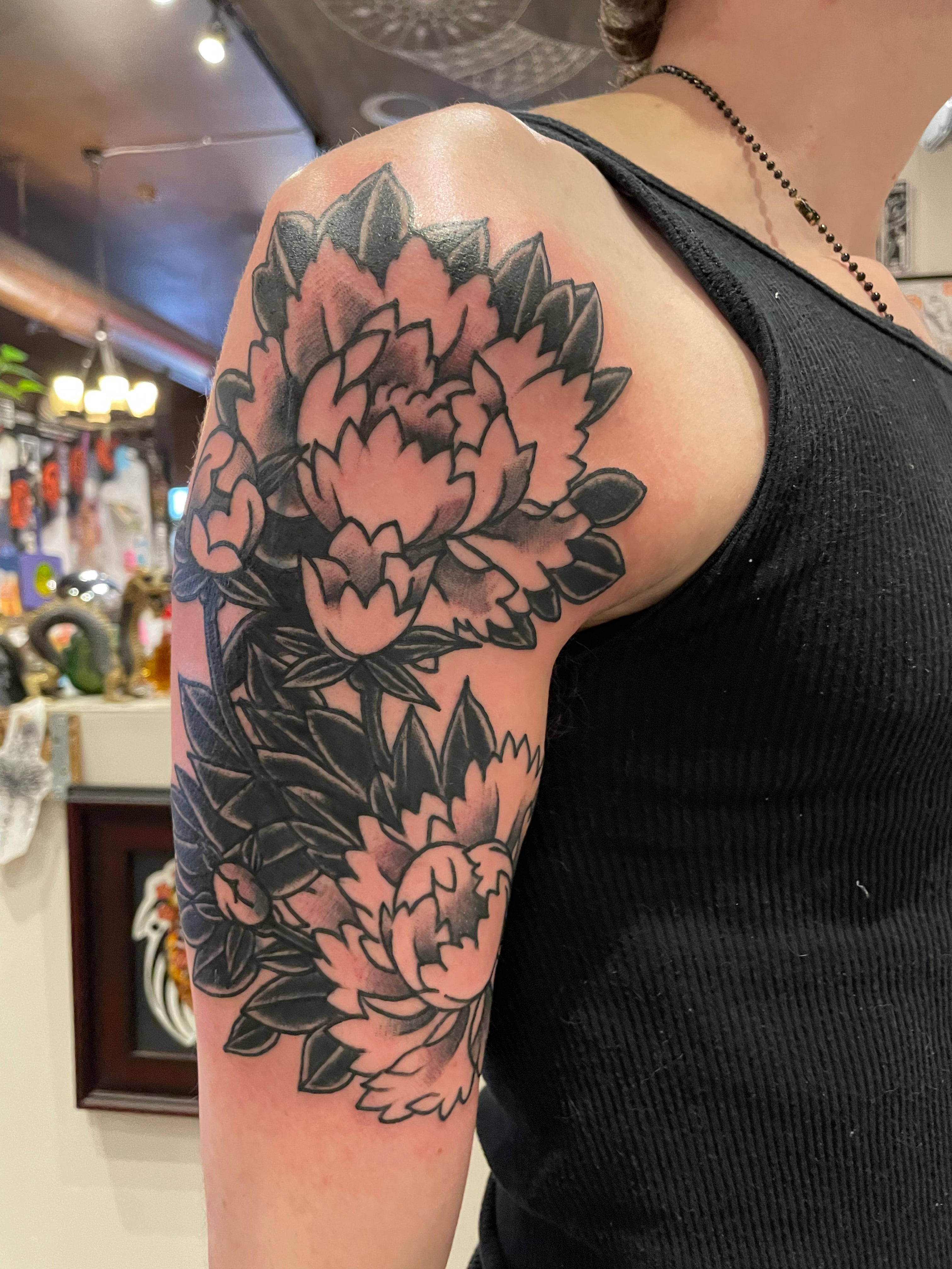 Andrea black and grey flower tattoo